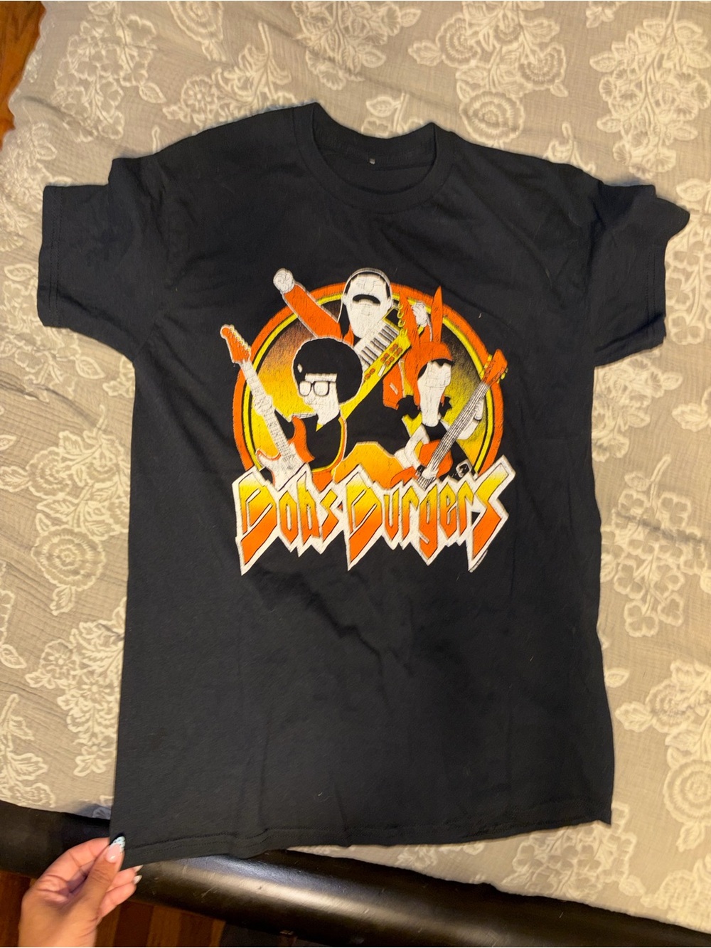 Spencer's Black Tee with Orange & Yellow 'Bobs Burgers' Band Graphic